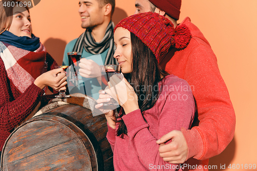 Image of Smiling european men and women during party photoshoot.