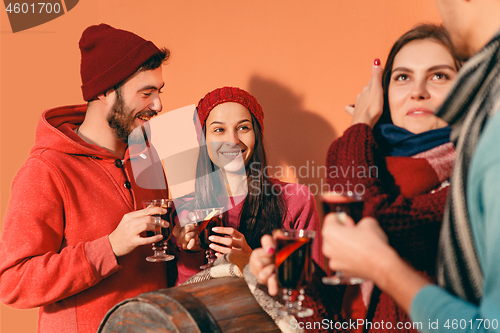 Image of Smiling european men and women during party photoshoot.