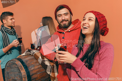 Image of Smiling european men and women during party photoshoot.