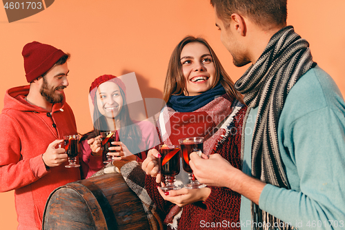 Image of Smiling european men and women during party photoshoot.