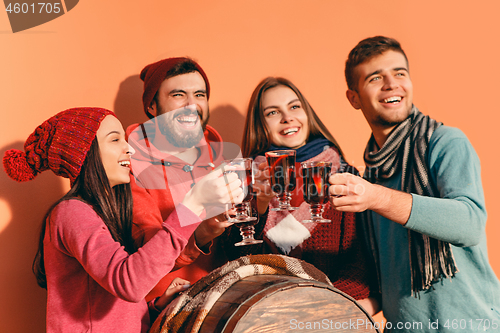 Image of Smiling european men and women during party photoshoot.