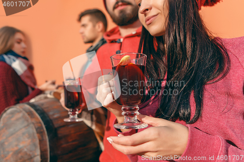 Image of Smiling european men and women during party photoshoot.