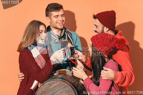 Image of Smiling european men and women during party photoshoot.