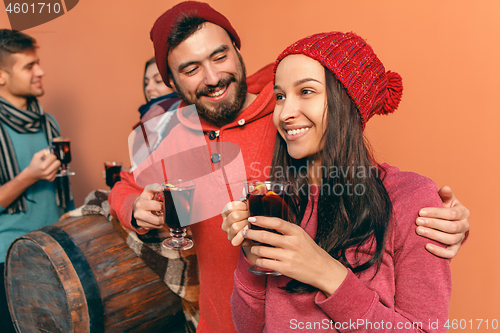 Image of Smiling european men and women during party photoshoot.