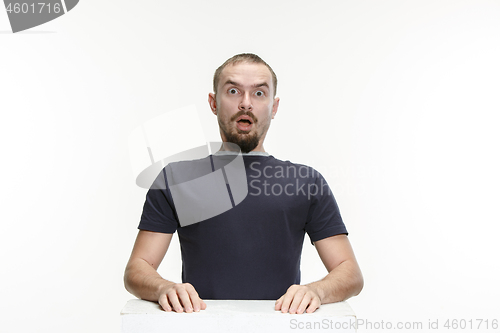 Image of The young attractive man looking suprised