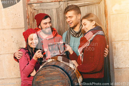 Image of Smiling european men and women during party photoshoot.