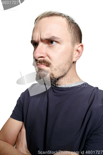 Image of Serious business man standing on white studio background