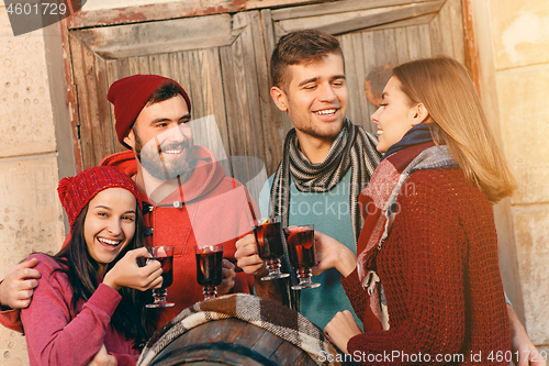 Image of Smiling european men and women during party photoshoot.