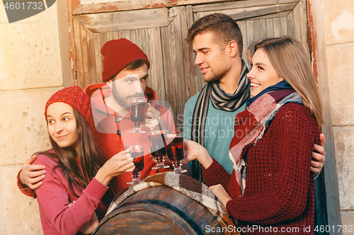 Image of Smiling european men and women during party photoshoot.