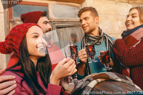 Image of Smiling european men and women during party photoshoot.