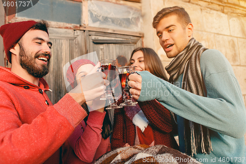 Image of Smiling european men and women during party photoshoot.