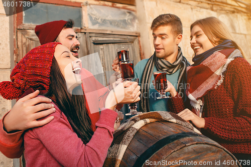 Image of Smiling european men and women during party photoshoot.