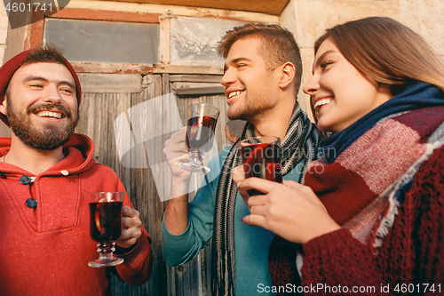 Image of Smiling european men and women during party photoshoot.