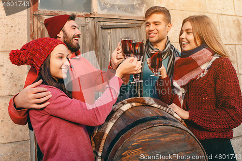 Image of Smiling european men and women during party photoshoot.