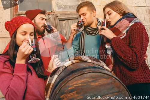 Image of Smiling european men and women during party photoshoot.