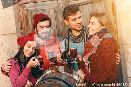 Image of Smiling european men and women during party photoshoot.