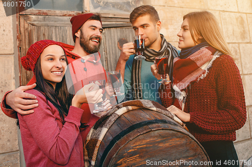 Image of Smiling european men and women during party photoshoot.