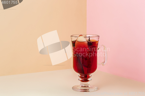 Image of Mulled wine in glass on on the glass table