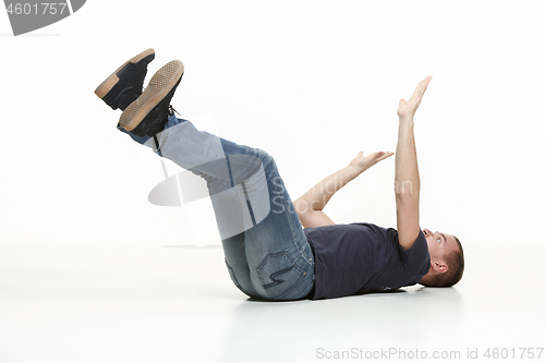 Image of young cool man full body scared pose.