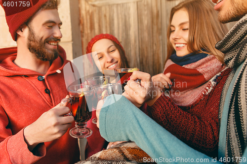 Image of Smiling european men and women during party photoshoot.