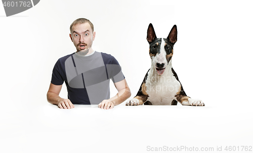 Image of Emotional Portrait of a man and his shepherd dog, concept of friendship and care of man and animal