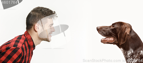 Image of Emotional Portrait of a man and his dog, concept of friendship and care of man and animal