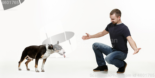 Image of Emotional Portrait of a man and his shepherd dog, concept of friendship and care of man and animal