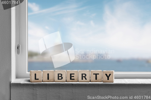 Image of Liberty sign in a window sill with a view