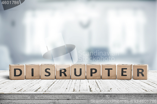 Image of Disrupter sign on an office desk