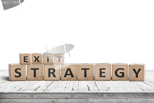 Image of Exit strategy sign on a wooden desk