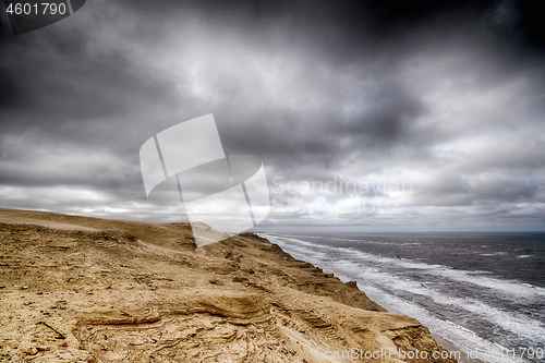 Image of Cloudy weather over a rough coastline