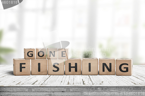 Image of Gone fishing message in a living room