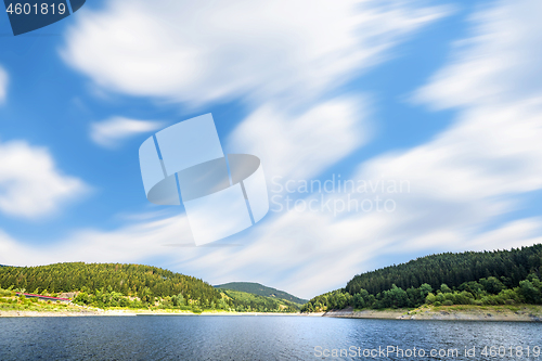 Image of Large lake under a blue sky in the wind