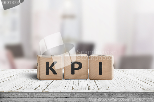 Image of KPI word on a wooden sign in a bright environment