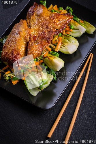 Image of Peking duck breast with pak choi and vegetables