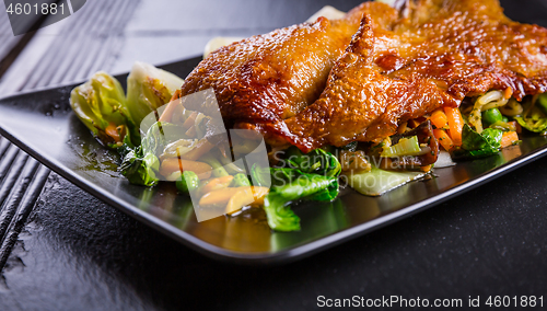 Image of Peking duck breast with pak choi and vegetables