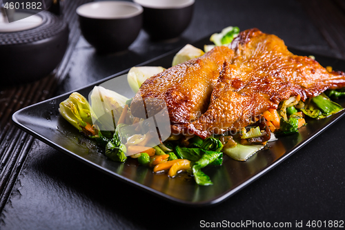 Image of Peking duck breast with pak choi and vegetables