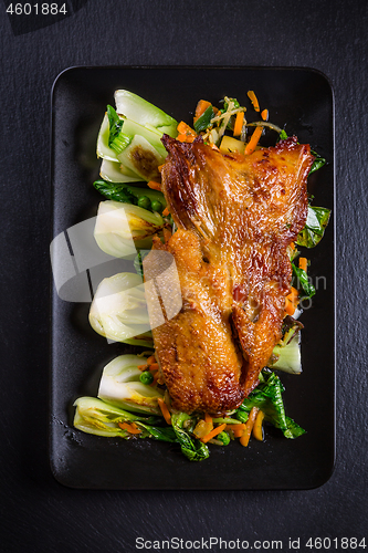 Image of Peking duck breast with pak choi and vegetables