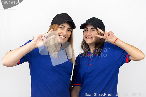 Image of Portrait of two different-aged girls, in the same clothes