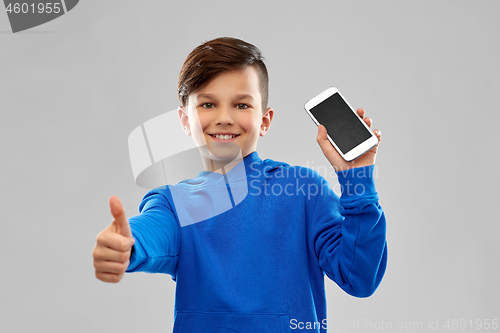 Image of smiling boy showing smartphone and thumbs up
