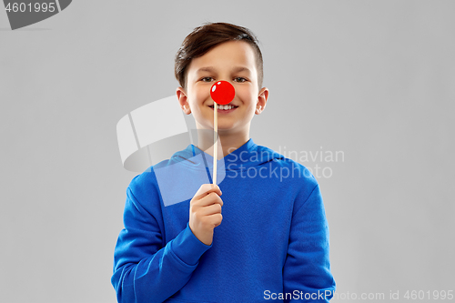 Image of smiling boy in blue hoodie with red clown nose