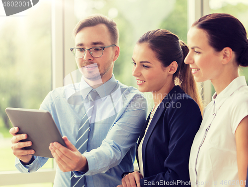 Image of business people with tablet pc computer at office