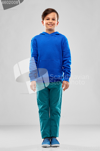 Image of smiling boy in blue hoodie