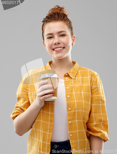 Image of happy redhead teenage girl with paper coffee cup