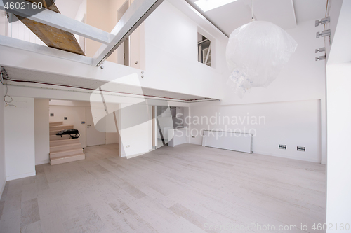 Image of Interior of empty stylish modern open space two level apartment