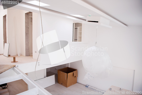 Image of Interior of empty stylish modern open space two level apartment