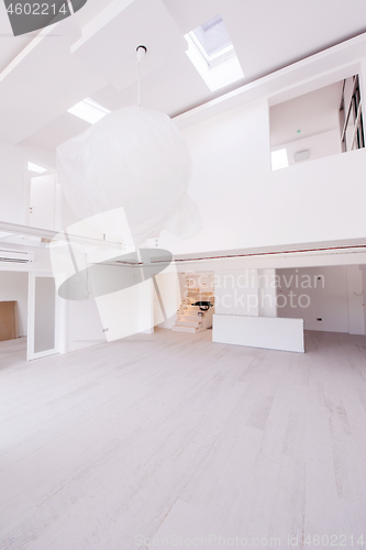 Image of Interior of empty stylish modern open space two level apartment