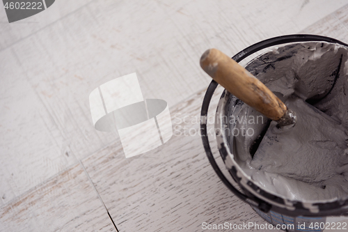 Image of Ceramic wood effect tiles and tools for tiler on the floor
