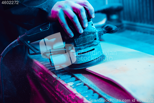 Image of Skater in process of making his own skateboard, longboard - open business concept