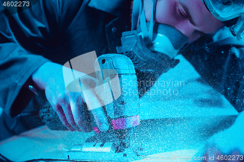 Image of Skater in process of making his own skateboard, longboard - open business concept